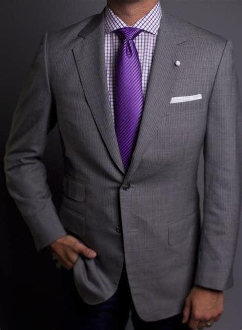 gray suit shirt purple tie.